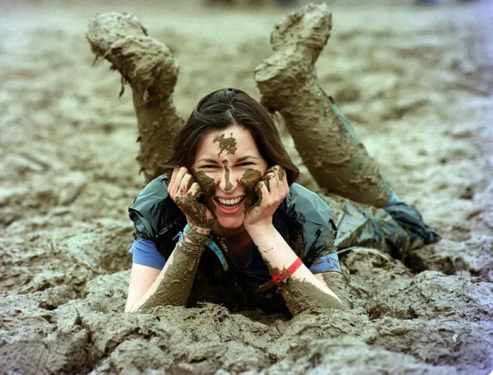 Framed Print : Lucy Rock enjoying the mud at Glastonbury festival June 1997