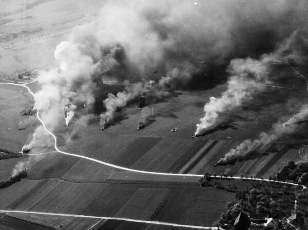 The Luftwaffe going up in smoke following a fighter sweep by P51 Mustangs of the US 8th