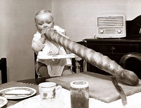 Lunch time! Little John Millar starts his huge sandwich - a large stick of french bread