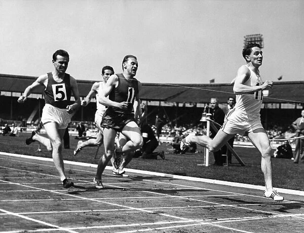 M. A. Rawson of Great Britain winning the 880 yds international, from K. H