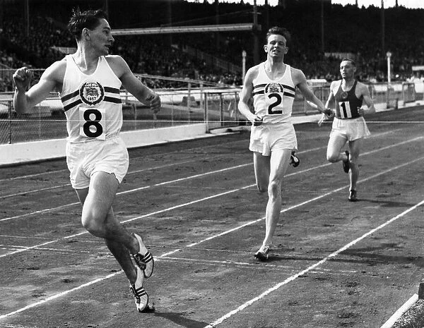 M. A. Rawson (No. 8) Gt. Britain, winning the 800 metres event from M. A. Farrell (Gt