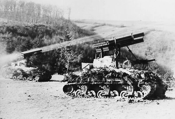 M4 tank fires rockets at Beisdorf, Germany during Second World War. 10th March 1945