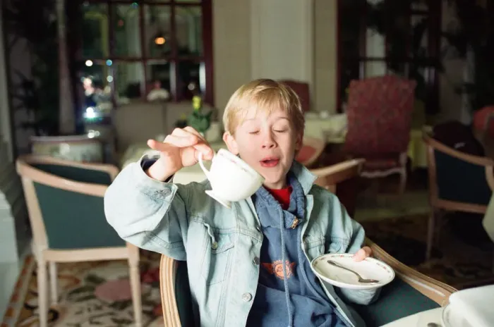 Framed Print : Macaulay Culkin sips his tea as he toasts his membership of he million-dollar-a movie