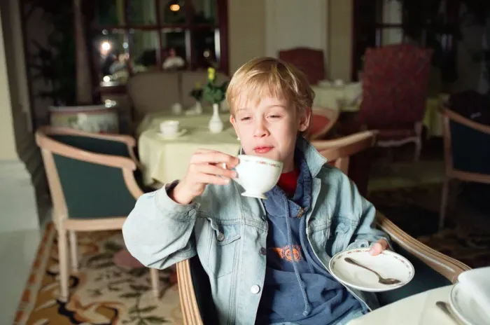 Framed Print : Macaulay Culkin sips his tea as he toasts his membership of he million-dollar-a movie Framed Print : Macaulay Culkin sips his tea as he toasts his membership of he million-dollar-a movie