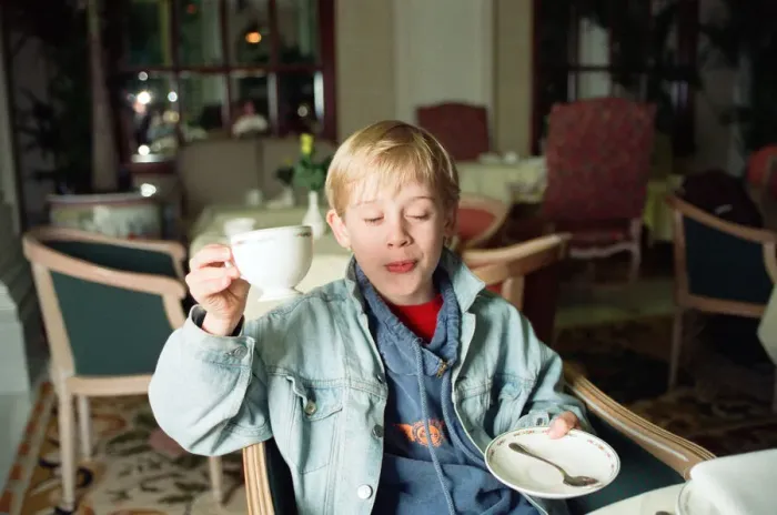 Framed Print : Macaulay Culkin sips his tea as he toasts his membership of he million-dollar-a movie