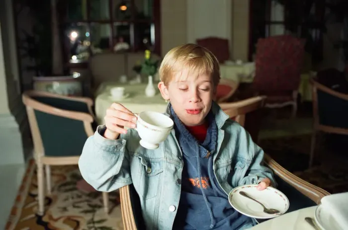 Framed Print : Macaulay Culkin sips his tea as he toasts his membership of he million-dollar-a movie Framed Print : Macaulay Culkin sips his tea as he toasts his membership of he million-dollar-a movie
