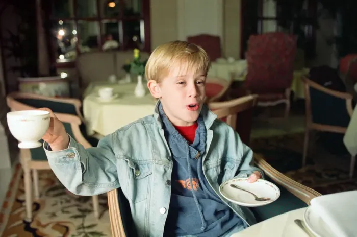 Framed Print : Macaulay Culkin sips his tea as he toasts his membership of he million-dollar-a movie Framed Print : Macaulay Culkin sips his tea as he toasts his membership of he million-dollar-a movie