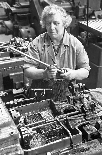 Machinist at the BSA Factory, Small Heath, Birmingham seen here manufacturing front forks