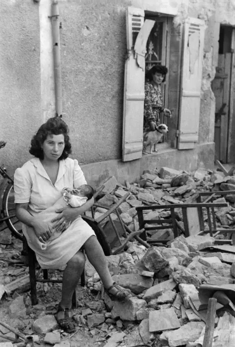 Framed Print : Madam Papin with her baby who was born at the height of the allied bombing of Caen Framed Print : Madam Papin with her baby who was born at the height of the allied bombing of Caen