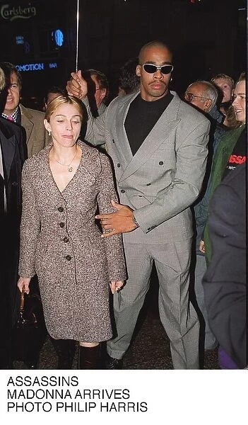 Madonna with her Bodygaurd at the premier of Assasins at the Warner Brothers Cinema in