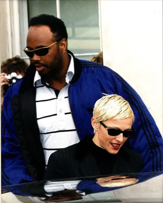 Framed Print : Madonna Singer Actress with burly minder leaving Lanesboruogh hotel