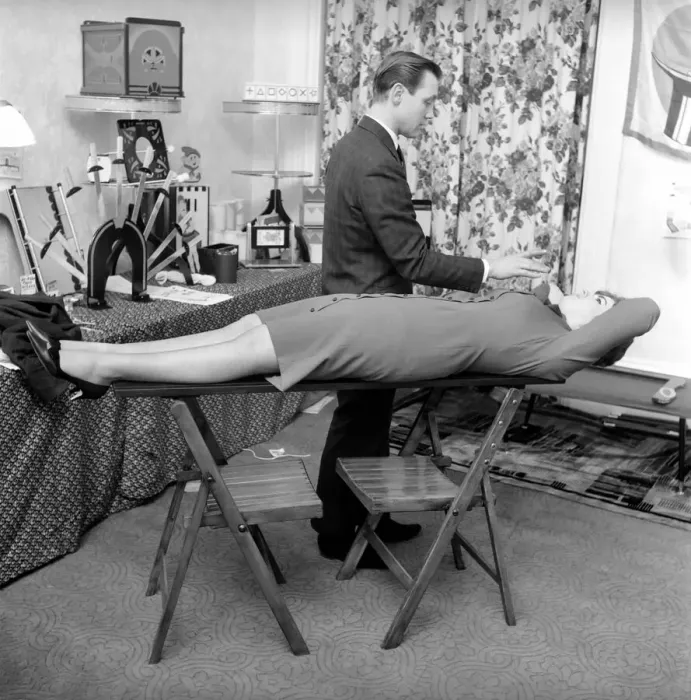 Framed Print : Magician Bernard Hughes: Performing a levitation trick on his female assistant Framed Print : Magician Bernard Hughes: Performing a levitation trick on his female assistant