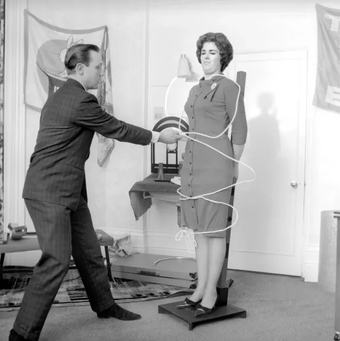Framed Print : Magician Bernard Hughes performing rope trick with female assistant Framed Print : Magician Bernard Hughes performing rope trick with female assistant