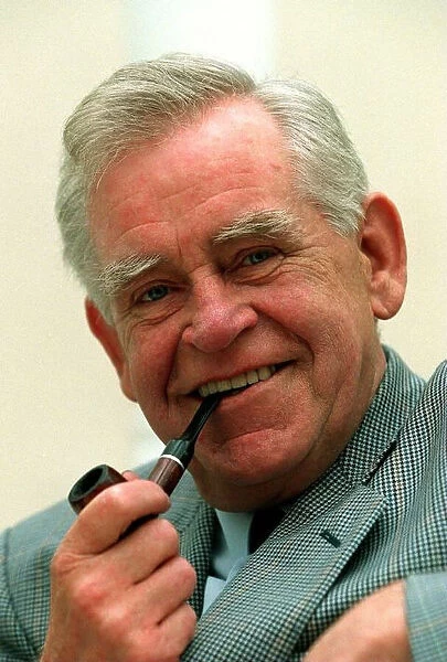 Magnus Magnusson TV Presenter Quiz Master August 1997 smoking pipe at the launch of