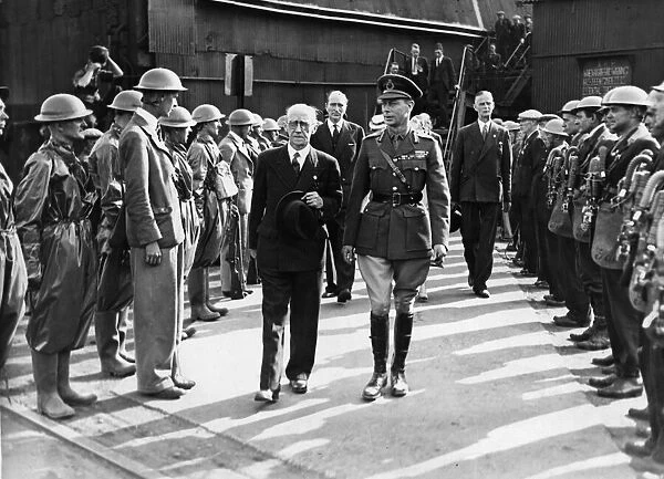 His Majesty King George VI walks through guard of honour formed by ARP wardens during his