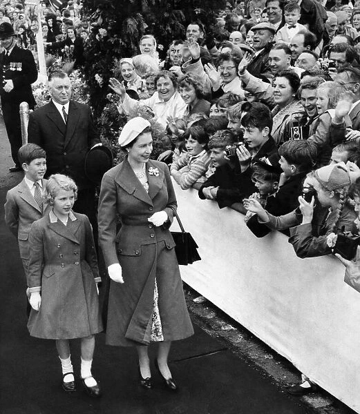 Her Majesty Queen Elizabeth II, accompanied by her two children Princes Anne