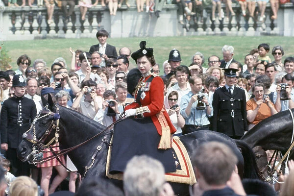 Her Majesty Queen Elizabeth II rides on horseback through The Mall in Central London