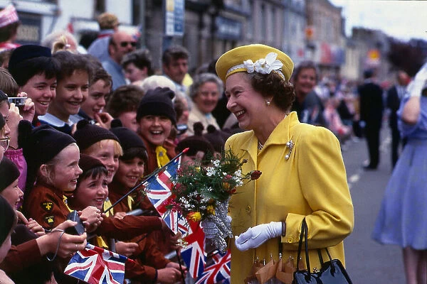 Her Majesty Queen Elizabeth II talking to brownies in the the crowd during a walkabout in