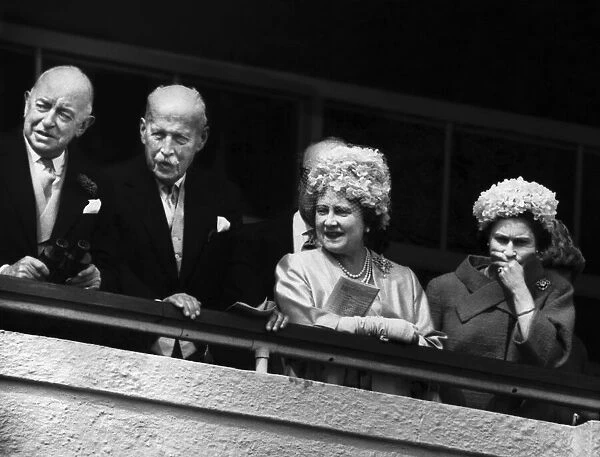 Her Majesty Queen Elizabeth II watches the horseracing from the Royal Box during