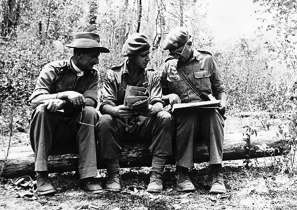 Major General Stockwell a lieutenant colonel and a brigadier hold a roadside conference
