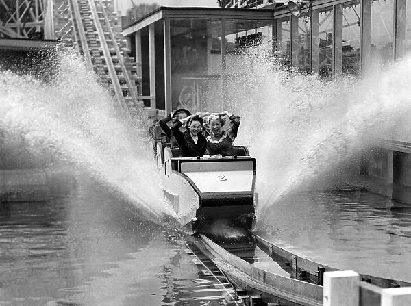 Making a splash at Battersea gardens, London. Photographs shows a merry party of some of