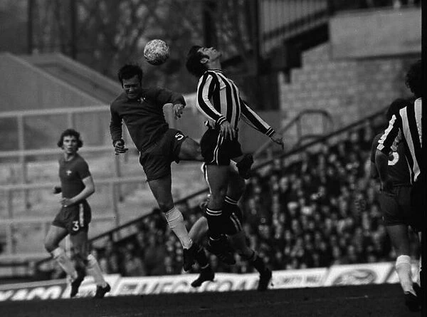 Malcolm Macdonald clashes with Chelseas Ron Harris during Chelsea v Newcastle United