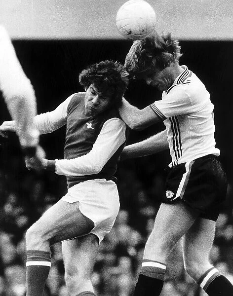 Malcolm MacDonald and Gordon McQueen clash April 1978 as they both head the ball