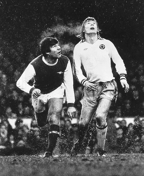 Malcolm MacDonald and Ken McNaught watch the ball Feb1978 during the Arsenal v