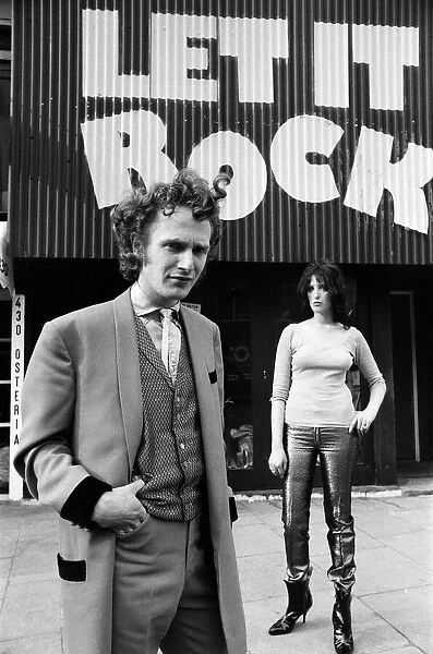 Malcolm McLaren dressed as a teddy boy outside his shop 'Let it Rock'