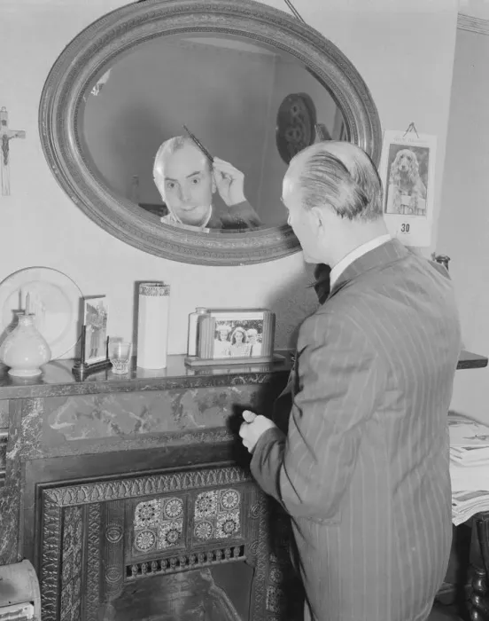 Framed Print : Male Grooming. Mr Frank Hancock seen here combing his hair Framed Print : Male Grooming. Mr Frank Hancock seen here combing his hair