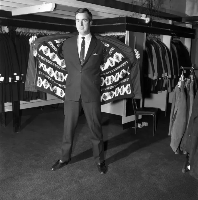 Framed Print : Male model wearing raincoat in menswear department. 1966 Framed Print : Male model wearing raincoat in menswear department. 1966