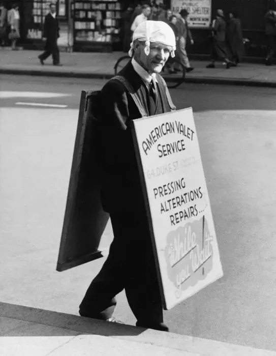 Framed Print : A man adverting an American Valet service walks down the road wearing a knotted Framed Print : A man adverting an American Valet service walks down the road wearing a knotted