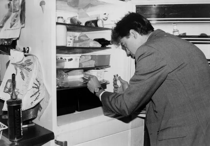 Framed Print : A man applies a swab test as he checks his fridge for bugs march 1991 Framed Print : A man applies a swab test as he checks his fridge for bugs march 1991