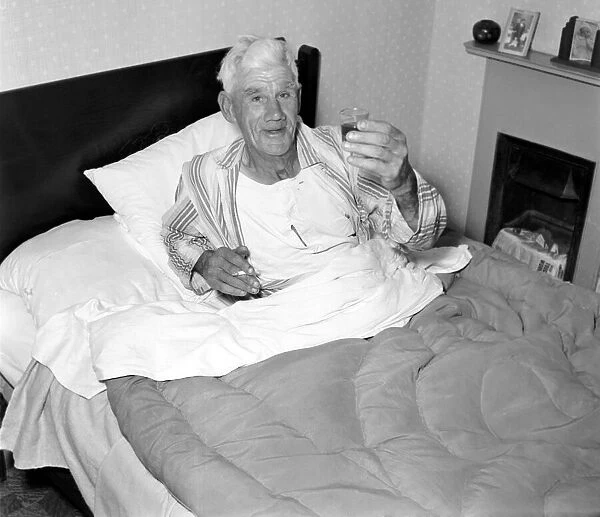 Man in bed. September 1953 D5548-001