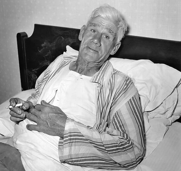 Man in bed. September 1953 D5548