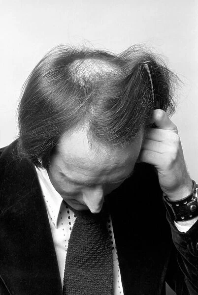 Man combing his hair. July 1975 75-00177-006
