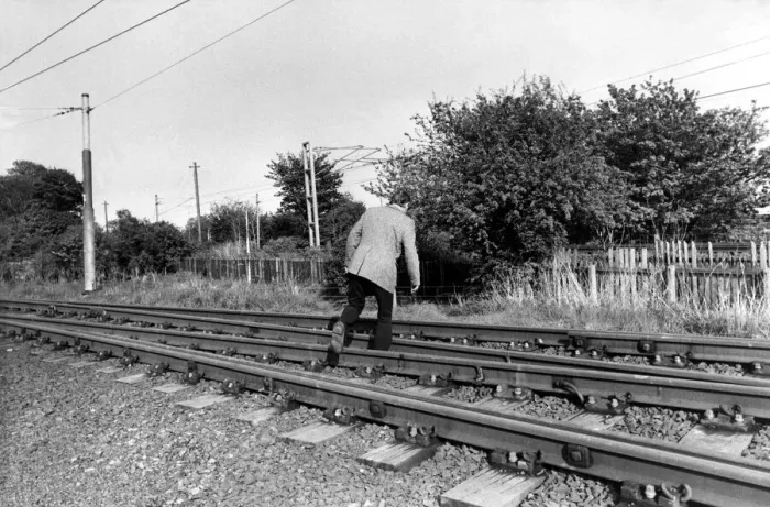 Framed Print : A man crossing the railway line illegally on 13th May 1981 Framed Print : A man crossing the railway line illegally on 13th May 1981