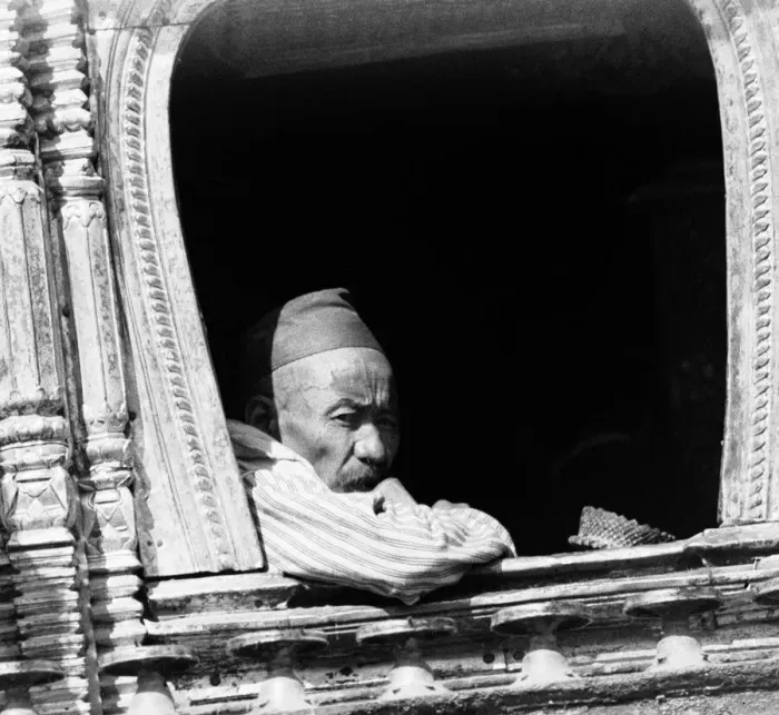 Framed Print : A man deep in thought looks out from a window of a buddhist temple in Katmandu, Nepal Framed Print : A man deep in thought looks out from a window of a buddhist temple in Katmandu, Nepal