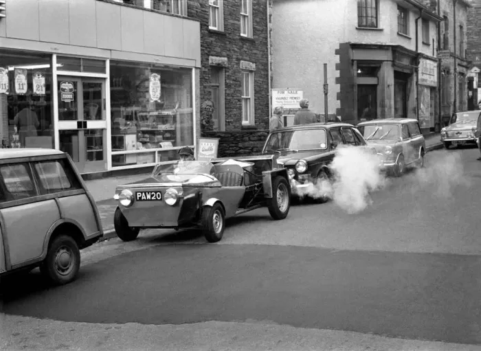 Framed Print : Man driving a steam powered car near his home December 1970 70-11615-009