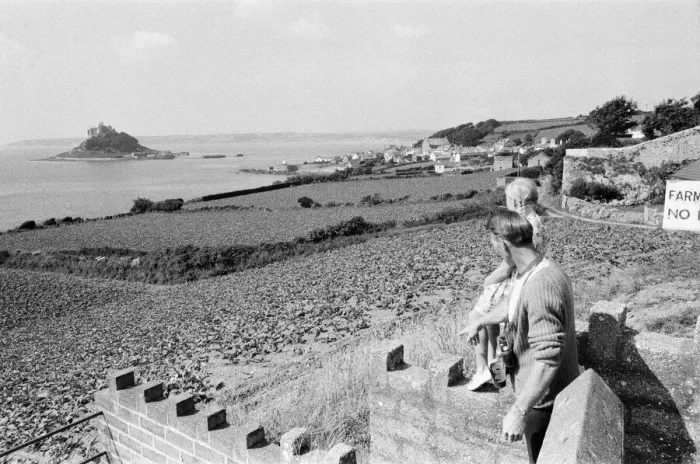 Framed Print : A man and girl looking out to St Michaels Mount, Cornwall, September 1968