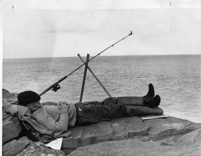 Framed Print : Man having forty winks while fishing. 24th June 1965
