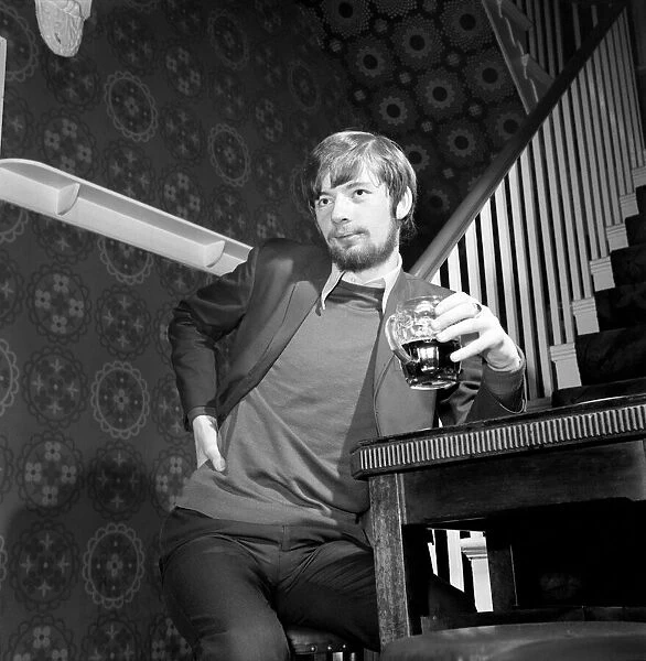 Man at home drinking a pint of beer. November 1969 Z10987