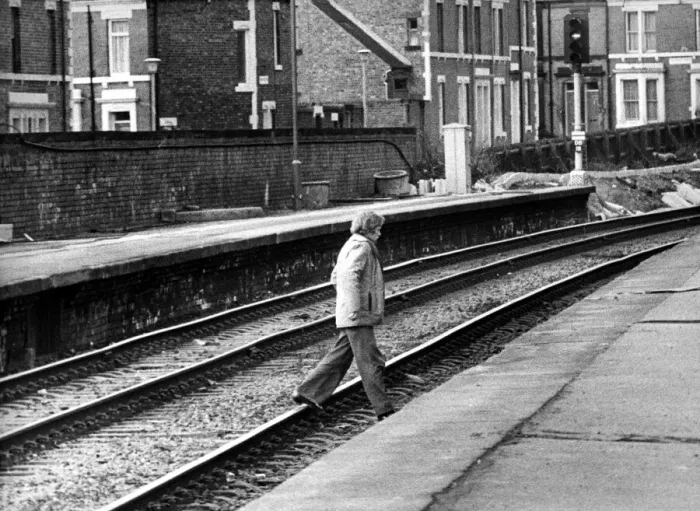 Framed Print : A man illegally crossing the railway line at West Jesmond Station on 12th March Framed Print : A man illegally crossing the railway line at West Jesmond Station on 12th March