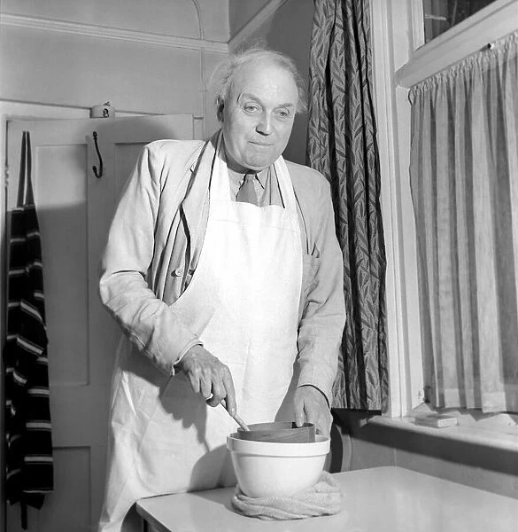 Man in Kitchen. September 1953 D5459