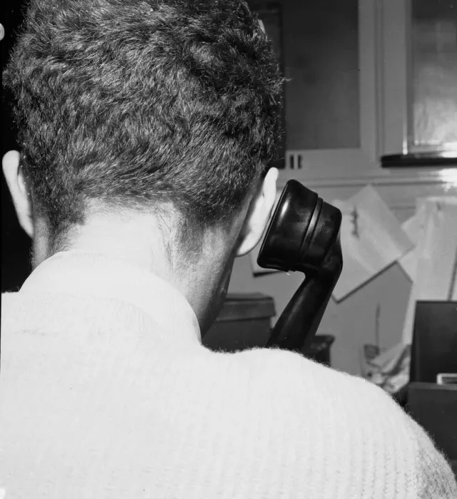 Framed Print : A man making a phone call from his office desk. 25th October 1957 Framed Print : A man making a phone call from his office desk. 25th October 1957