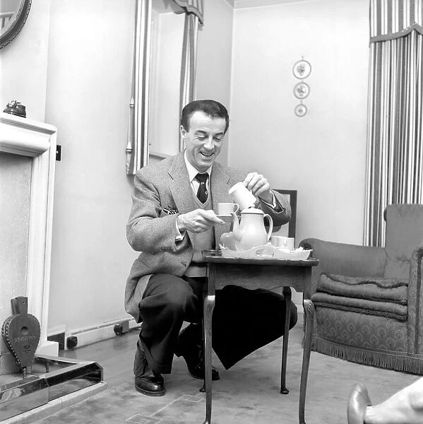 Man making a pot of tea: Wally Peterson. 1958 A219a