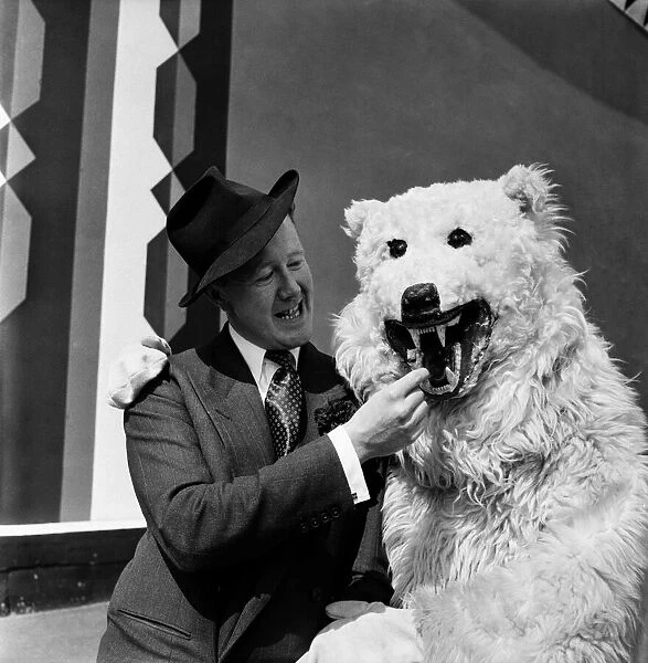 Man with man in bear costume at Battersea fun fair June 1952. August 1952 C2976-001