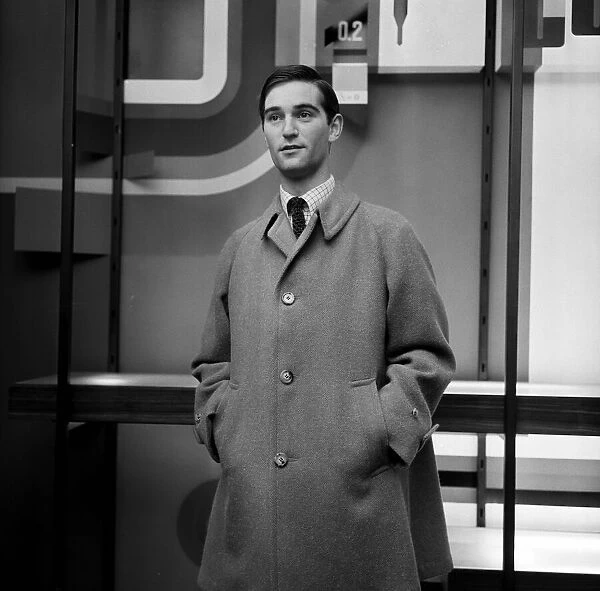 A man modelling an overcoat. 24th August 1965