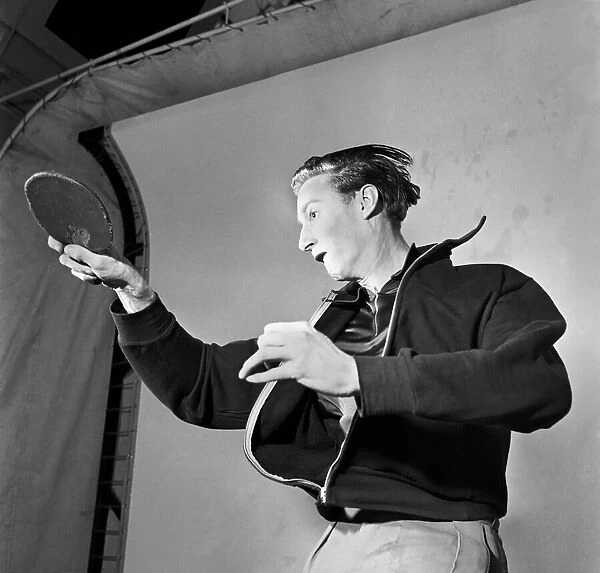 Man playing table tennis July 1953 D3734-001
