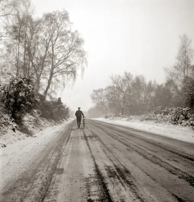 Framed Print : Man pushing bicycle along muddy country lane Countryside road Snow snowy Framed Print : Man pushing bicycle along muddy country lane Countryside road Snow snowy